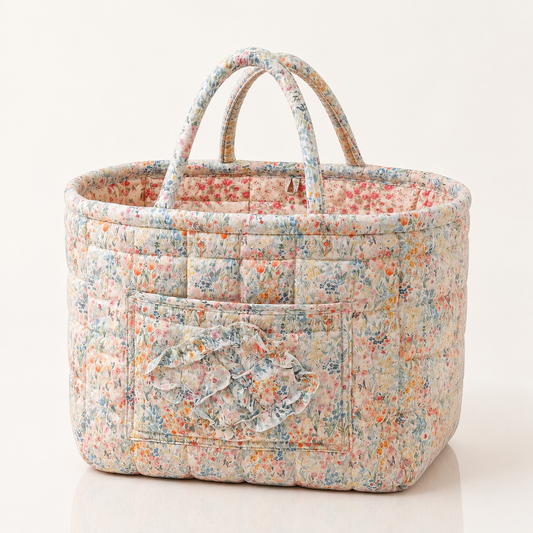 Quilted cotton storage basket with handles and front pocket