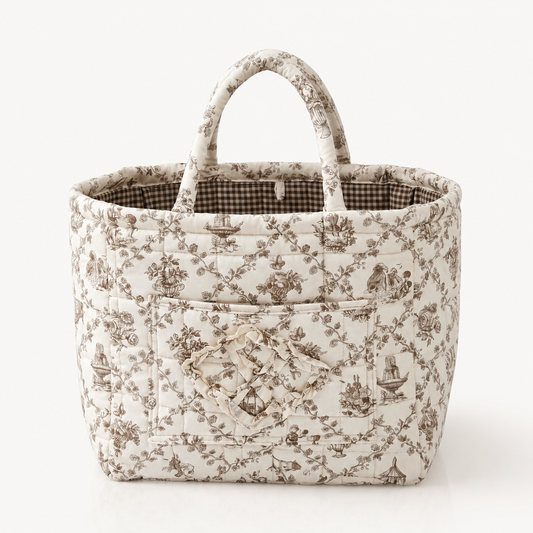 Quilted cotton storage basket with handles and front pocket