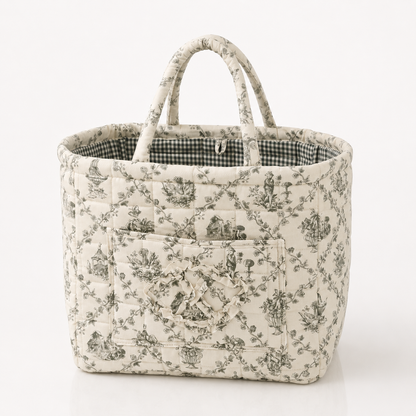 Quilted cotton storage basket with handles and front pocket