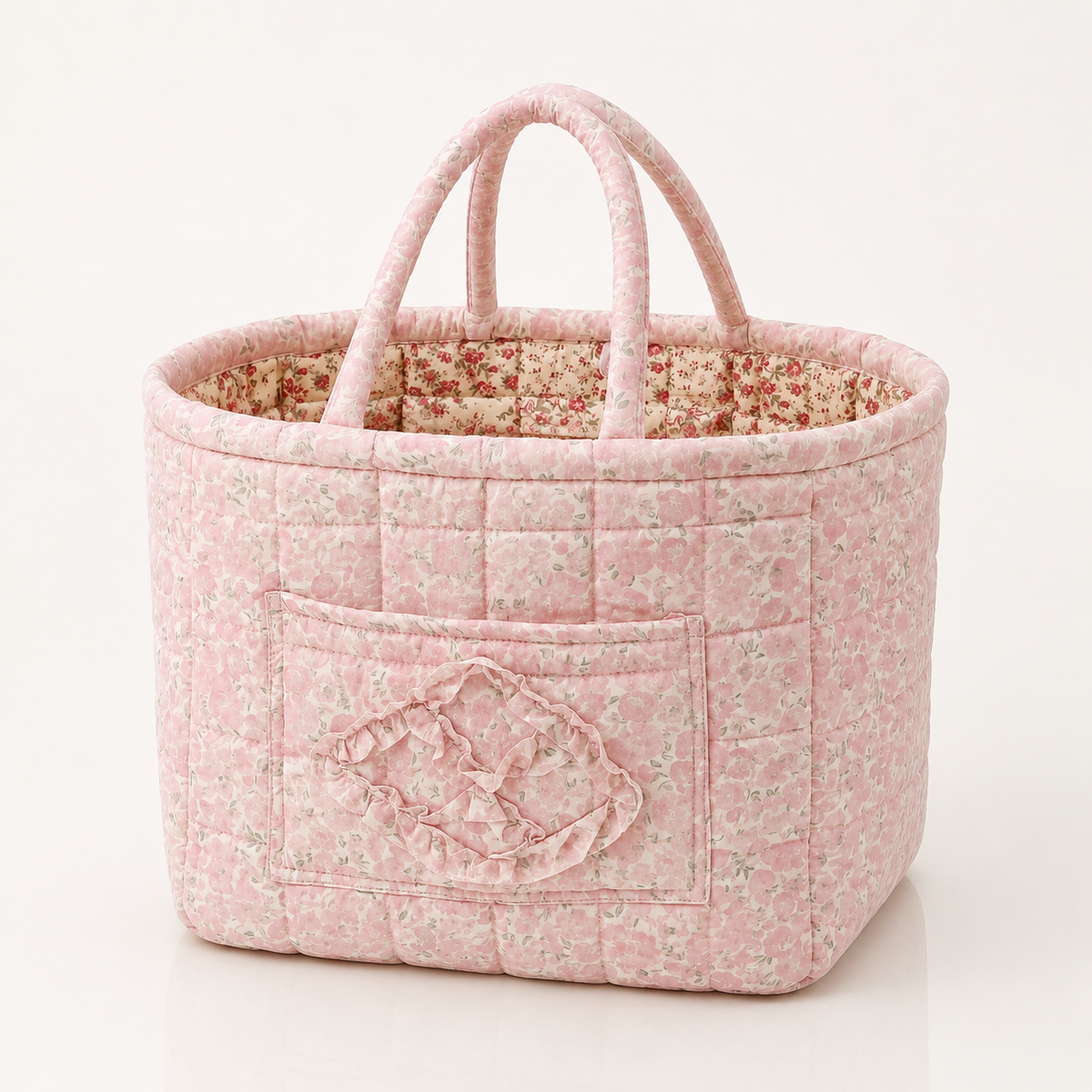 Quilted cotton storage basket with handles and front pocket