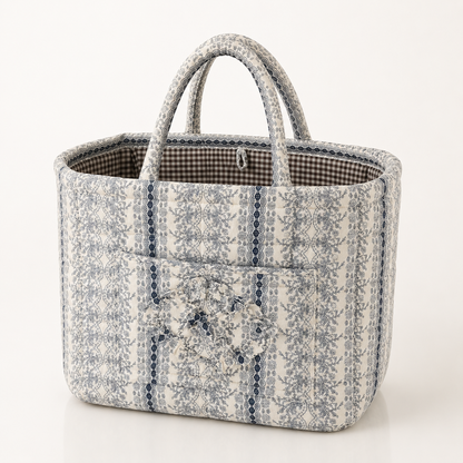 Quilted cotton storage basket with handles and front pocket
