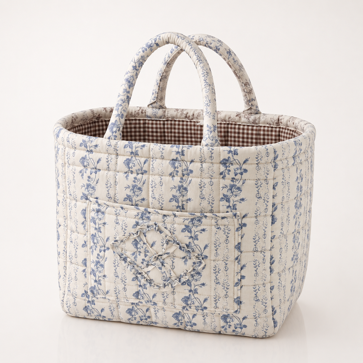 Quilted cotton storage basket with handles and front pocket
