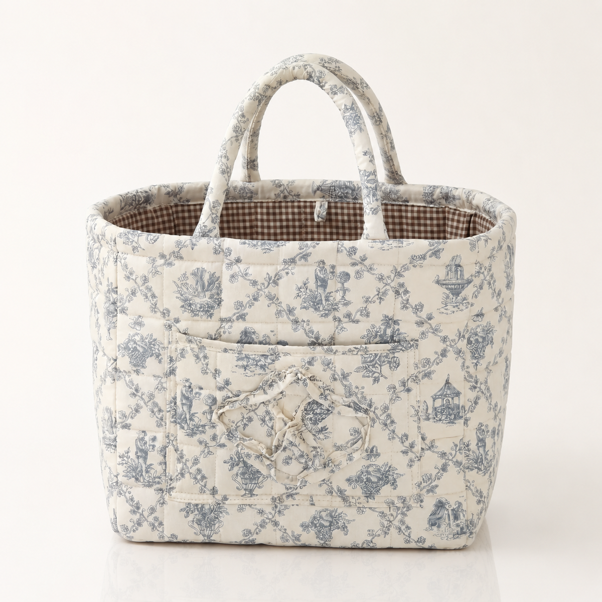 Quilted cotton storage basket with handles and front pocket