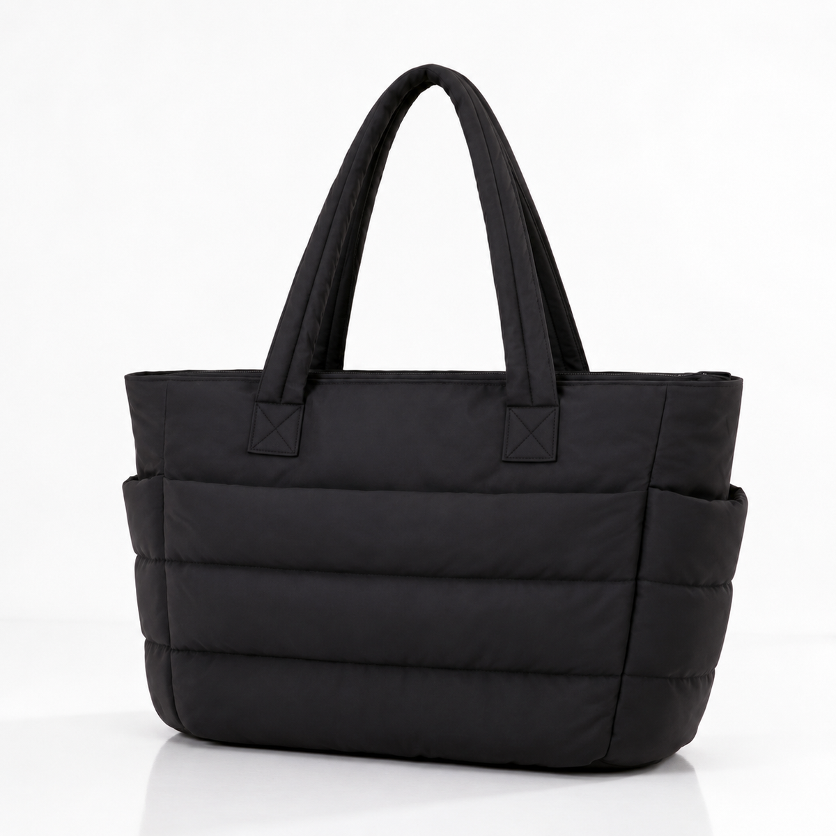 Black quilted laptop tote bag with water-resistant finish