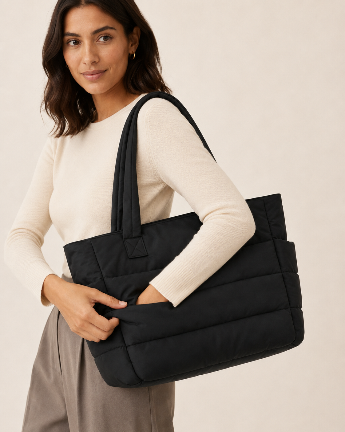 Black quilted laptop tote bag with water-resistant finish