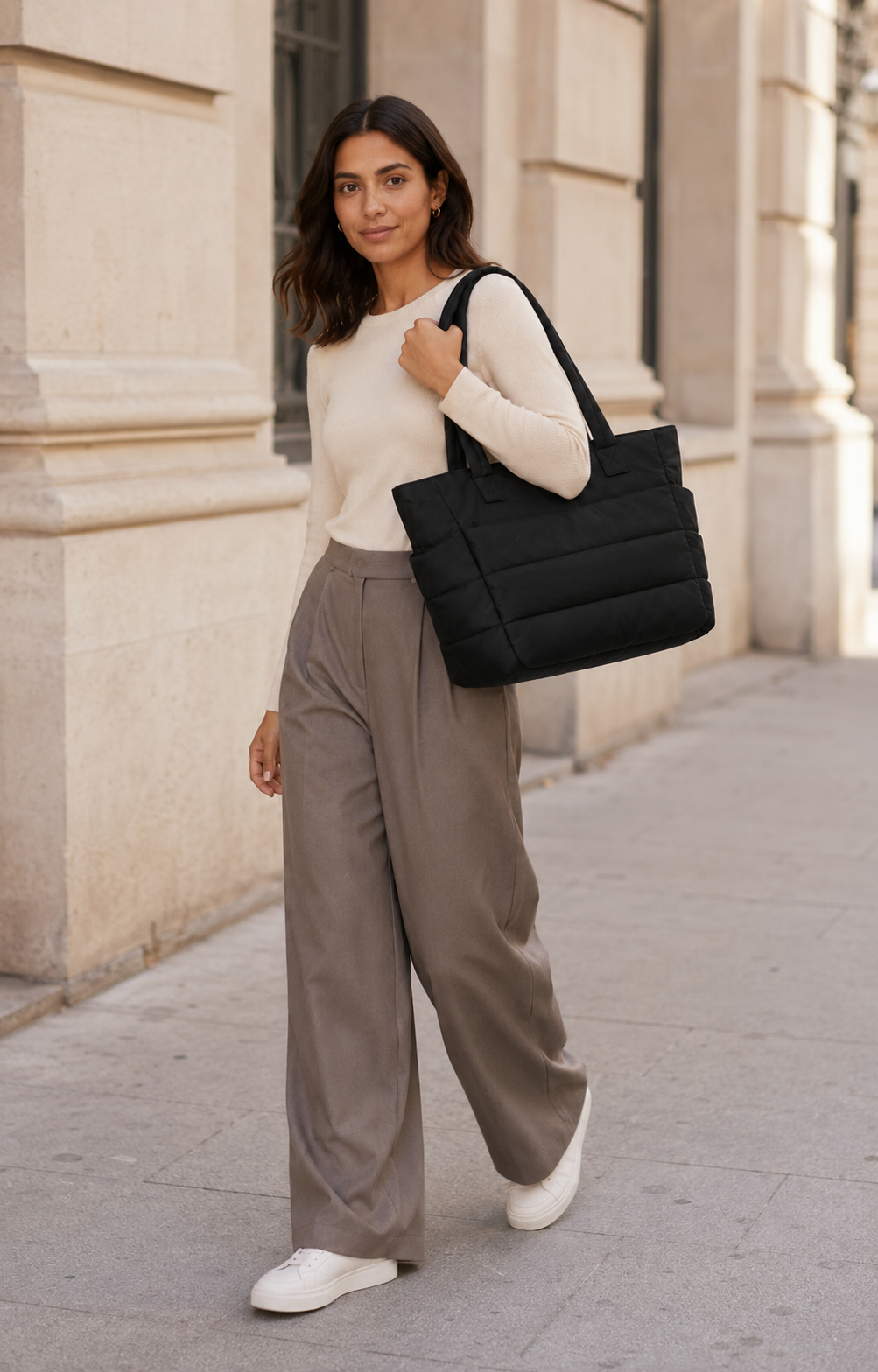 Black quilted laptop tote bag with water-resistant finish